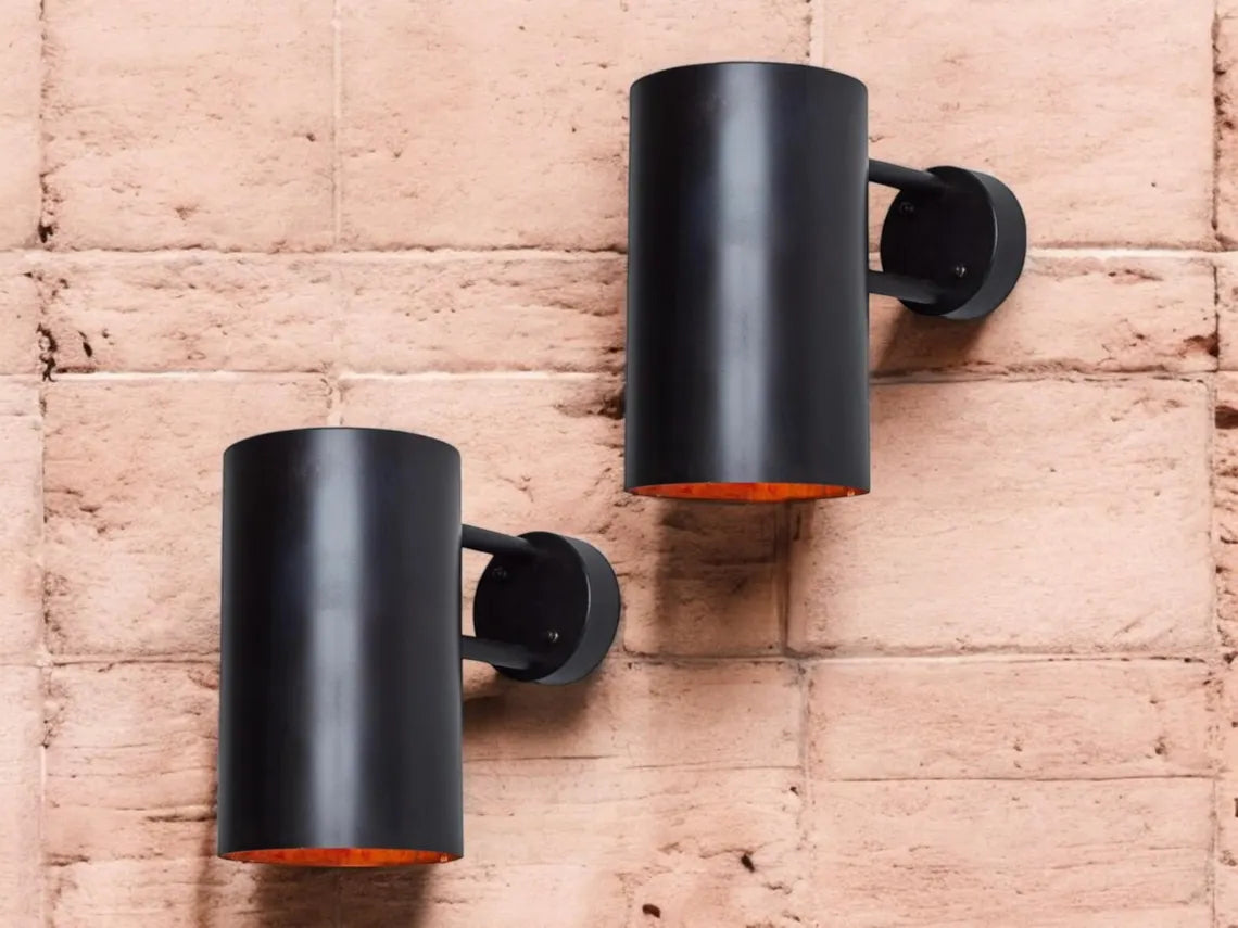 Oxidized black-patina copper wall sconce for outdoor use - modern cylindrical wall sconce with dark bronze exterior finish - copper sconce