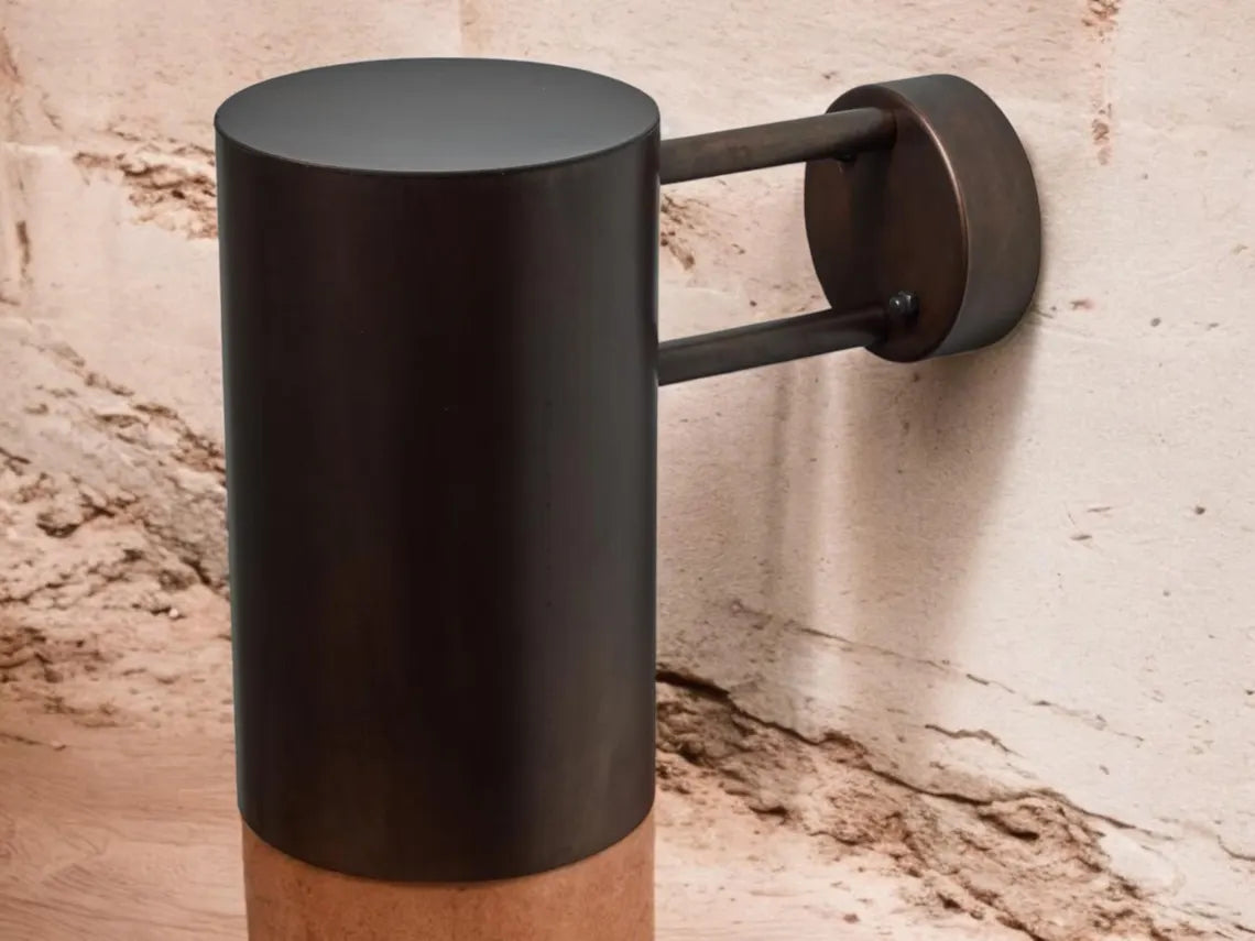 Oxidized black-patina copper wall sconce for outdoor use - modern cylindrical wall sconce with dark bronze exterior finish - copper sconce