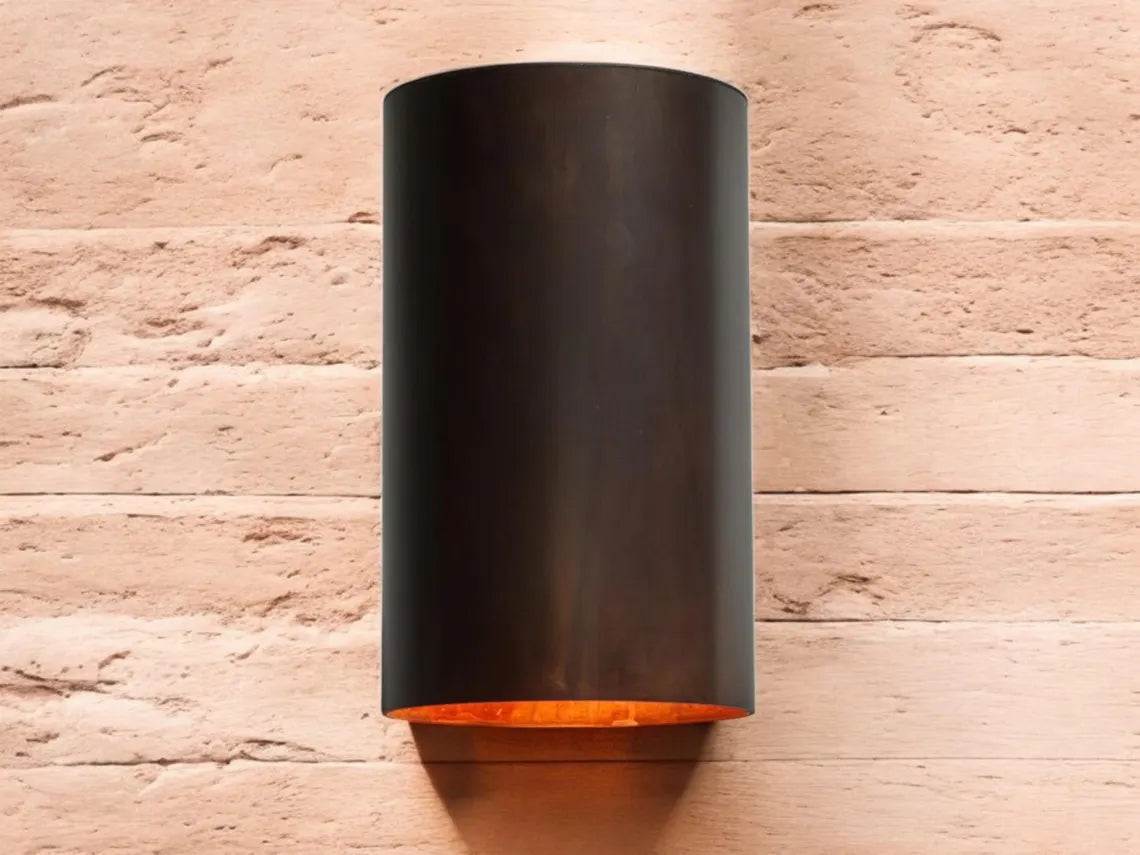 Oxidized black-patina copper wall sconce for outdoor use - modern cylindrical wall sconce with dark bronze exterior finish - copper sconce